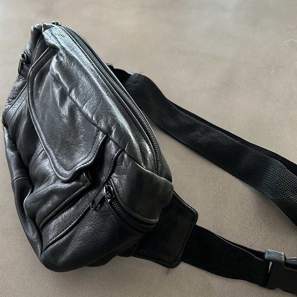 Like new black leather Fanny pack with multiple zippered compartments. - Picture 2 of 8